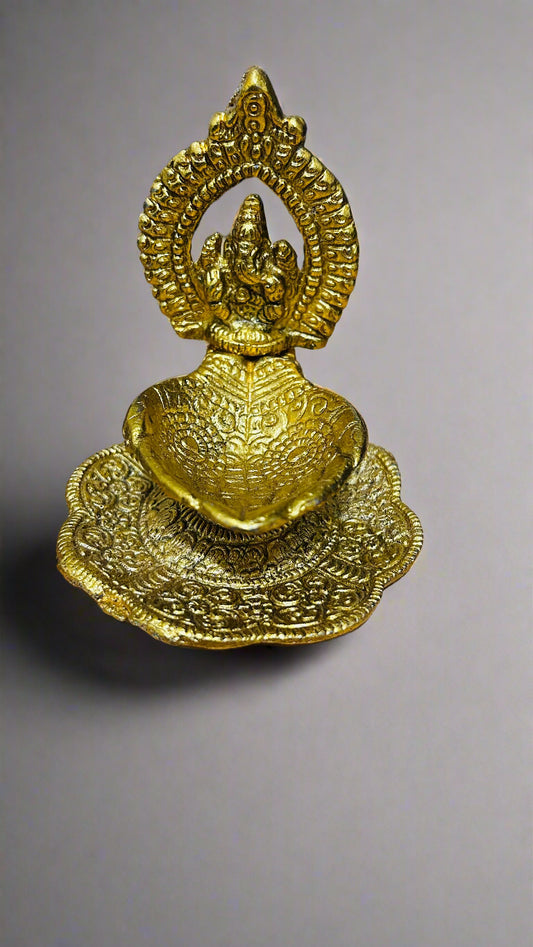 Gold decorative item on a wooden surface